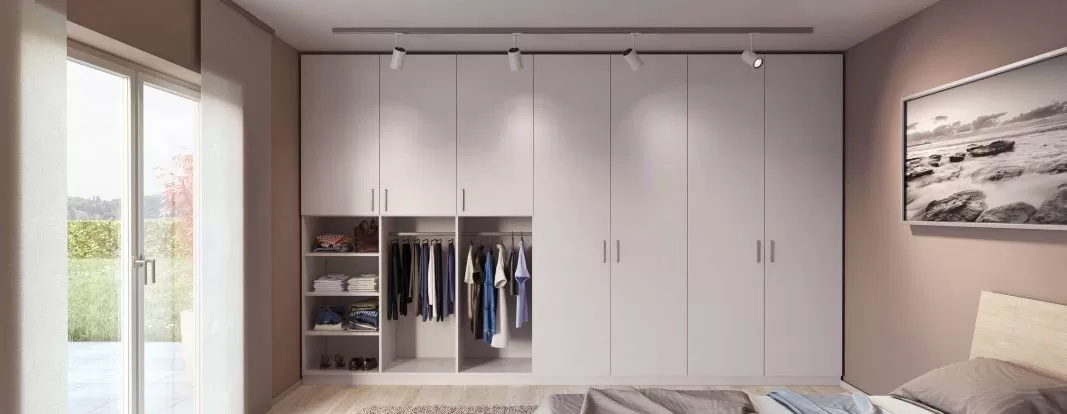 built-in wardrobe in the bedroom in a room niche